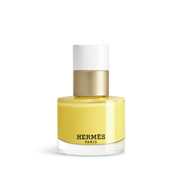 Jaune Pollen 22: Flakon lakieru Hermès w energetycznym, słoneczno-żółtym odcieniu; elegancki i świeży wygląd.