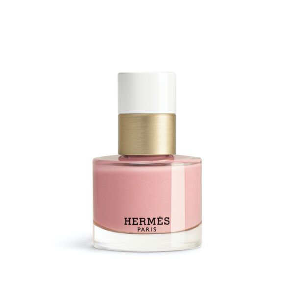 Rose Papillon 04: Flakon lakieru do paznokci Hermès w odcieniu jasnoróżowym z subtelnym połyskiem; elegancki design z białą i złotą zakrętką.